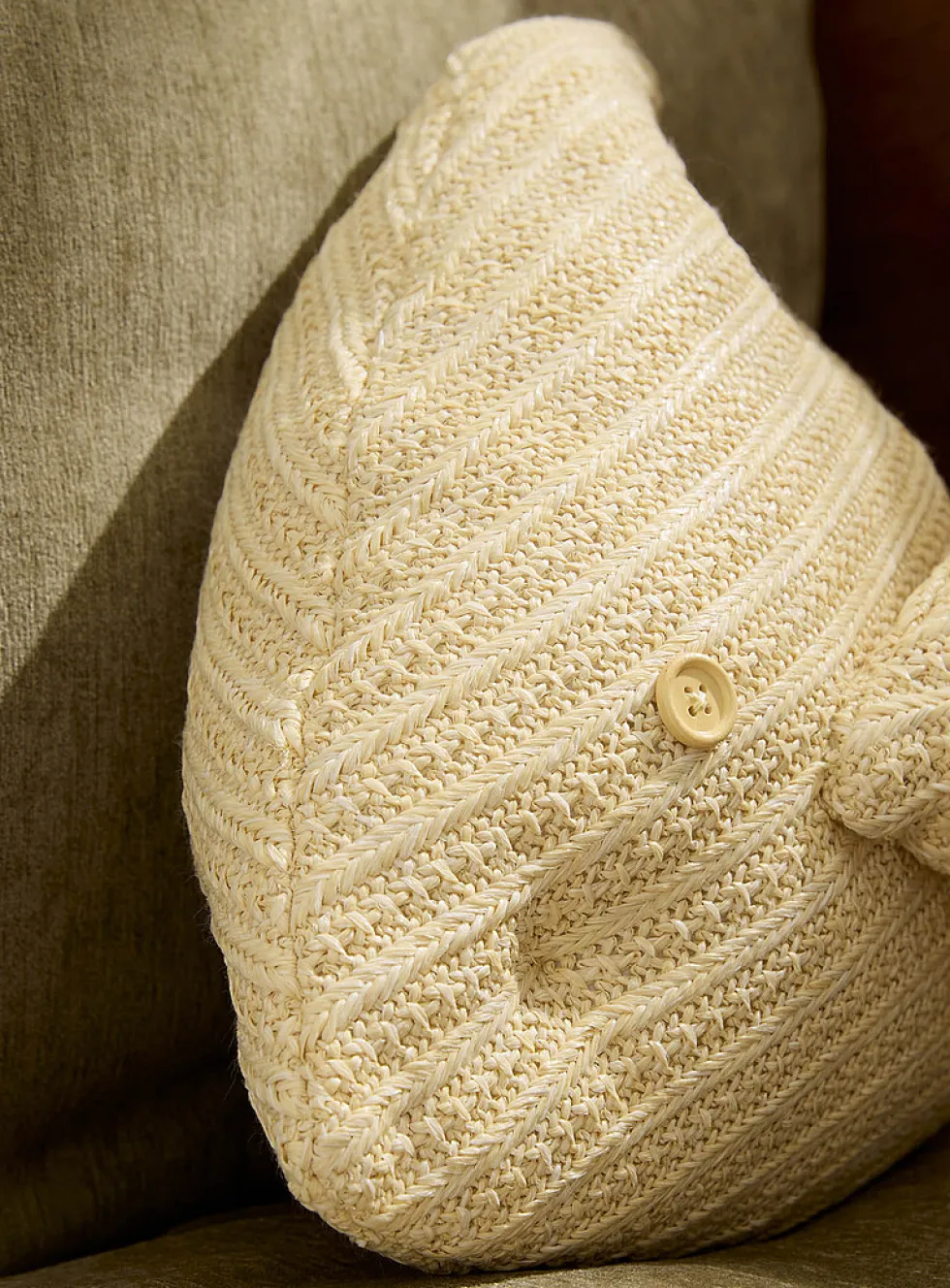 Fish-shaped faux-raffia outdoor cushion