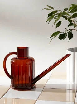 Fluted transparent watering can