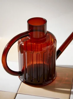 Fluted transparent watering can