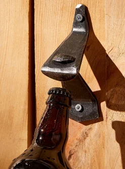 Forged wall-mounted bottle opener