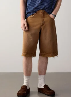 Frayed faded-brown jort