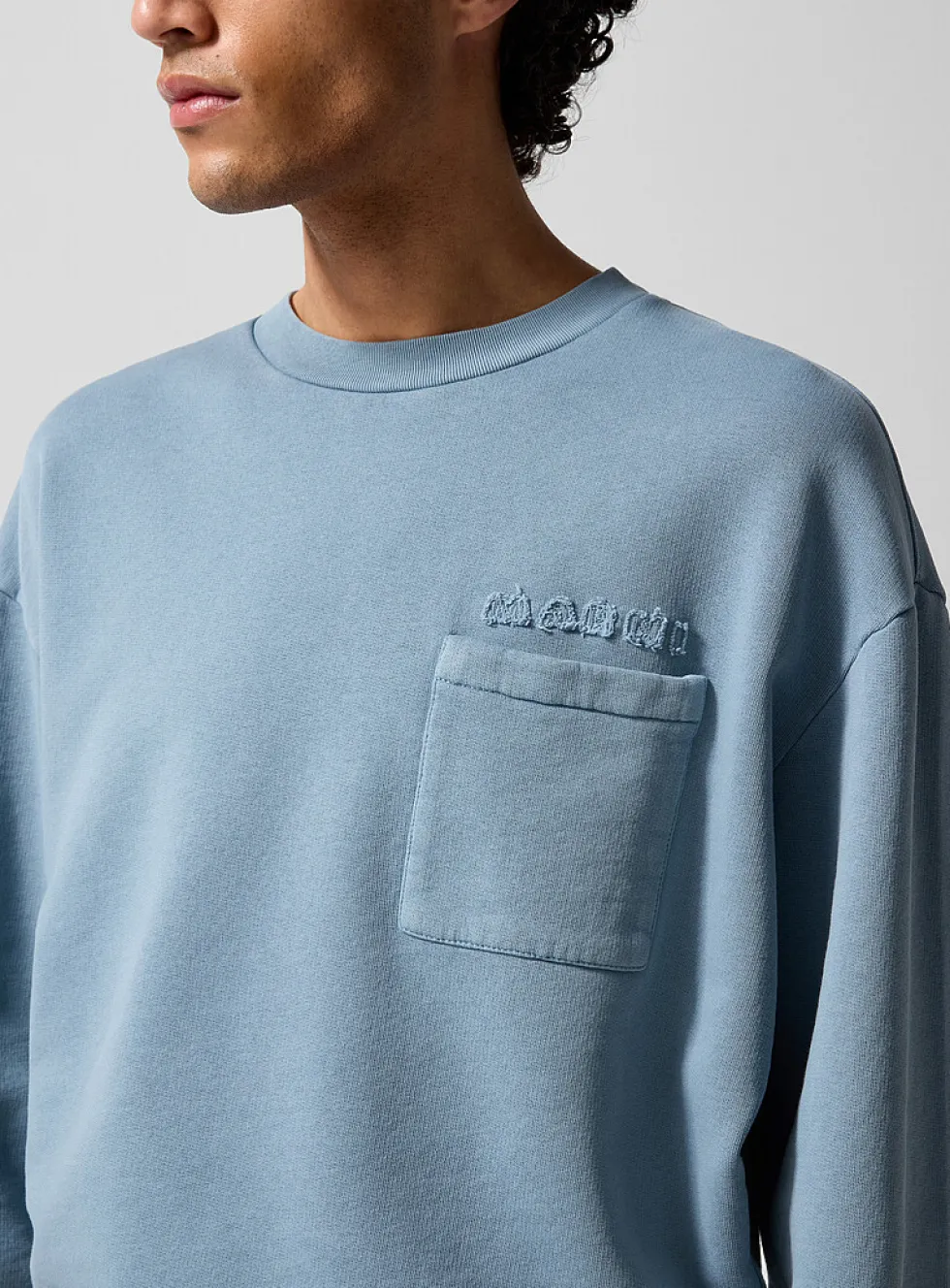 Frayed logo pocket sweatshirt