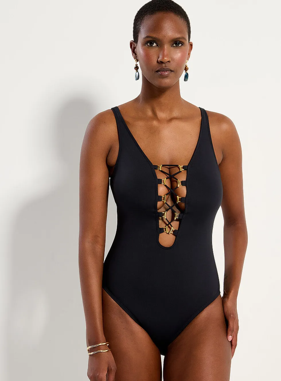 Gold accent laced neckline one-piece