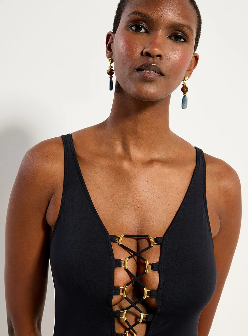 Gold accent laced neckline one-piece