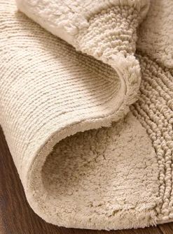 Half-moon bath mat