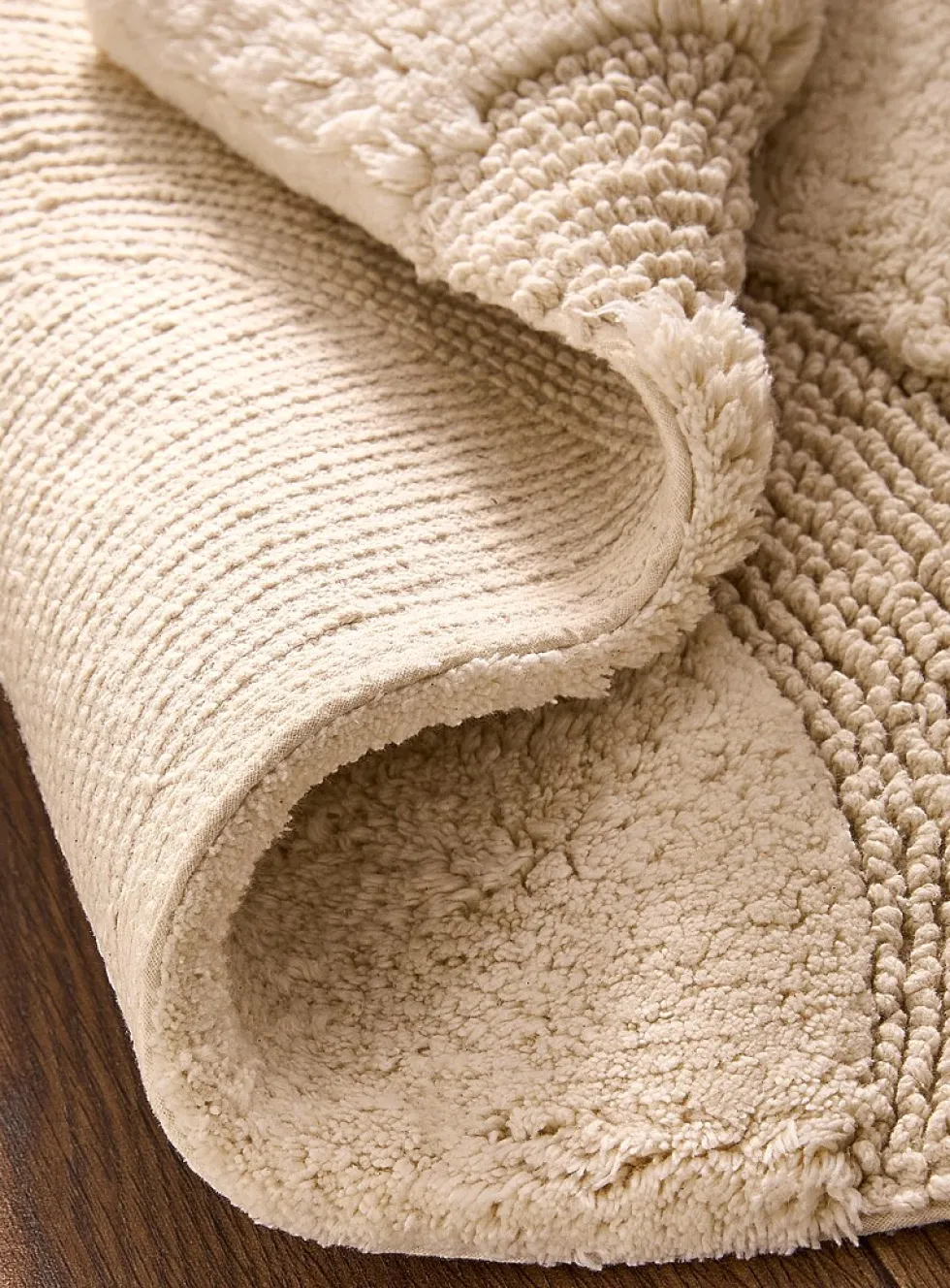 Half-moon bath mat