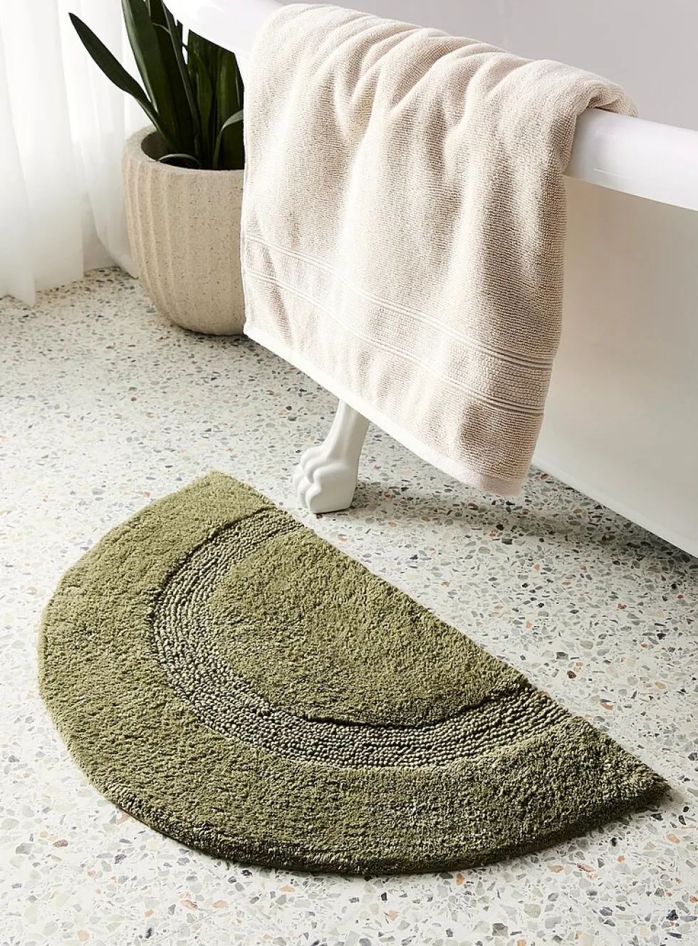 Half-moon bath mat