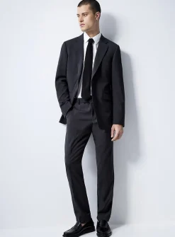 Justin Tenuta dark slate suit