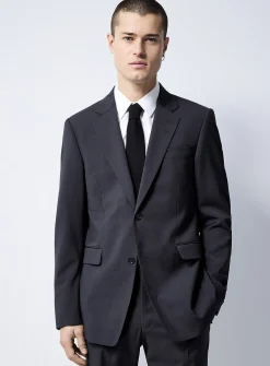 Justin Tenuta dark slate suit
