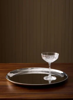 Large round metallic serving tray