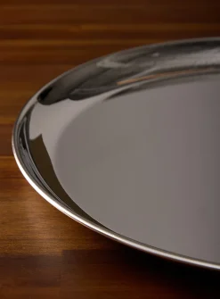 Large round metallic serving tray