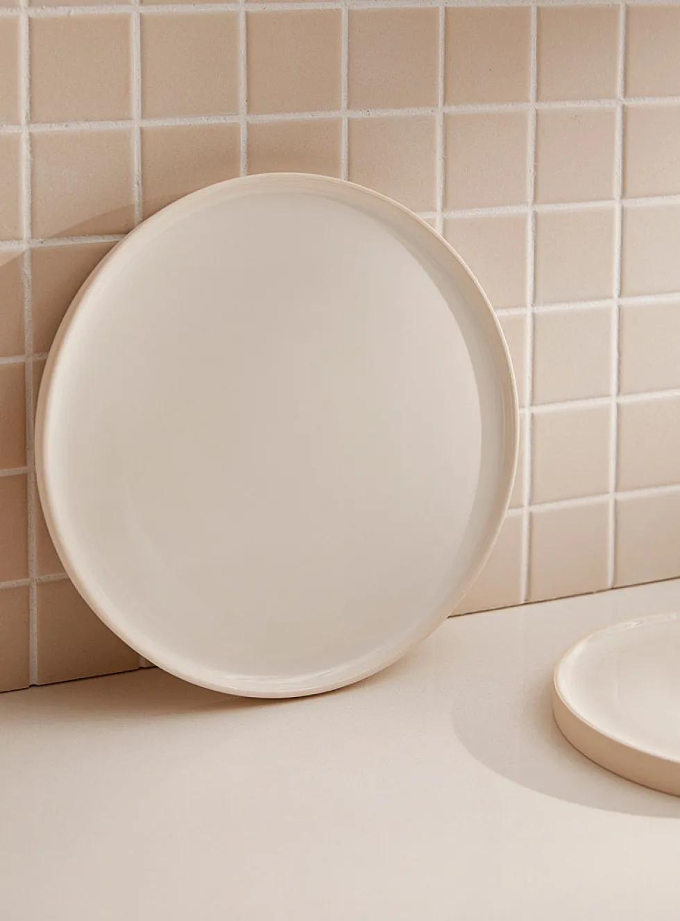 Large white glazed ceramic plate
