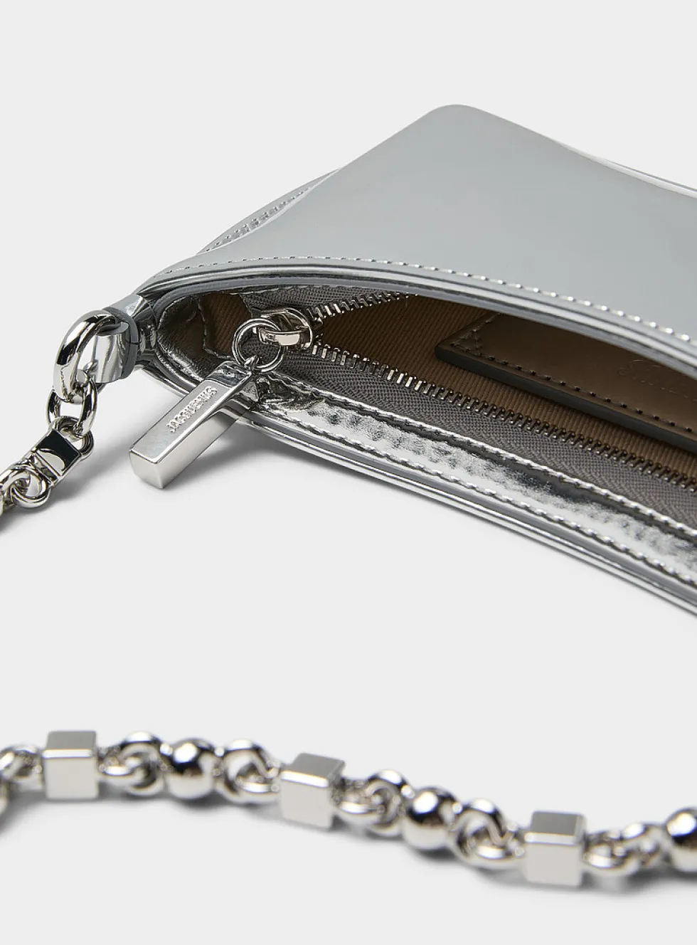 Le Petit Bisou chrome handbag