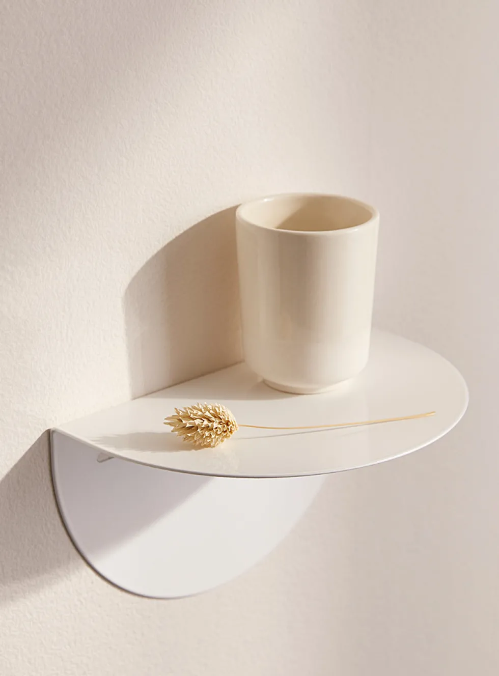 Minimalist half-moon wall shelf