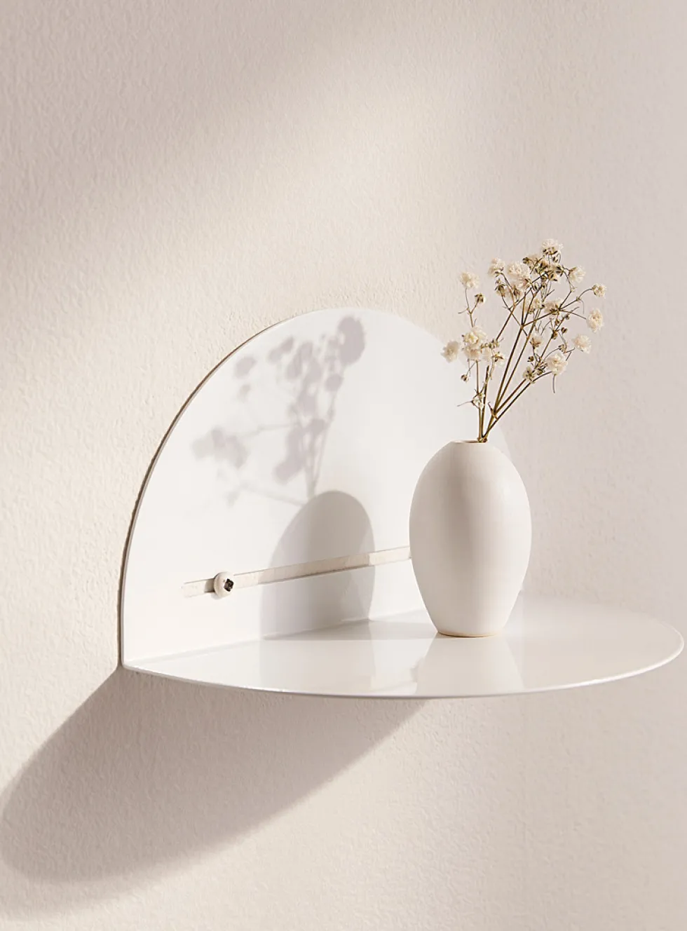 Minimalist half-moon wall shelf