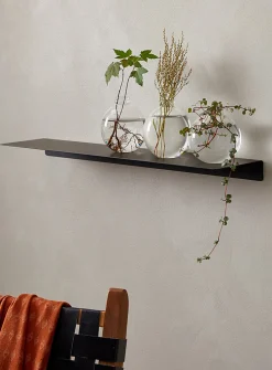 Minimalist steel wall shelf