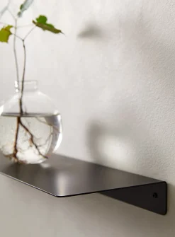Minimalist steel wall shelf