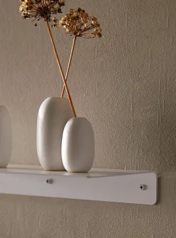 Minimalist steel wall shelf