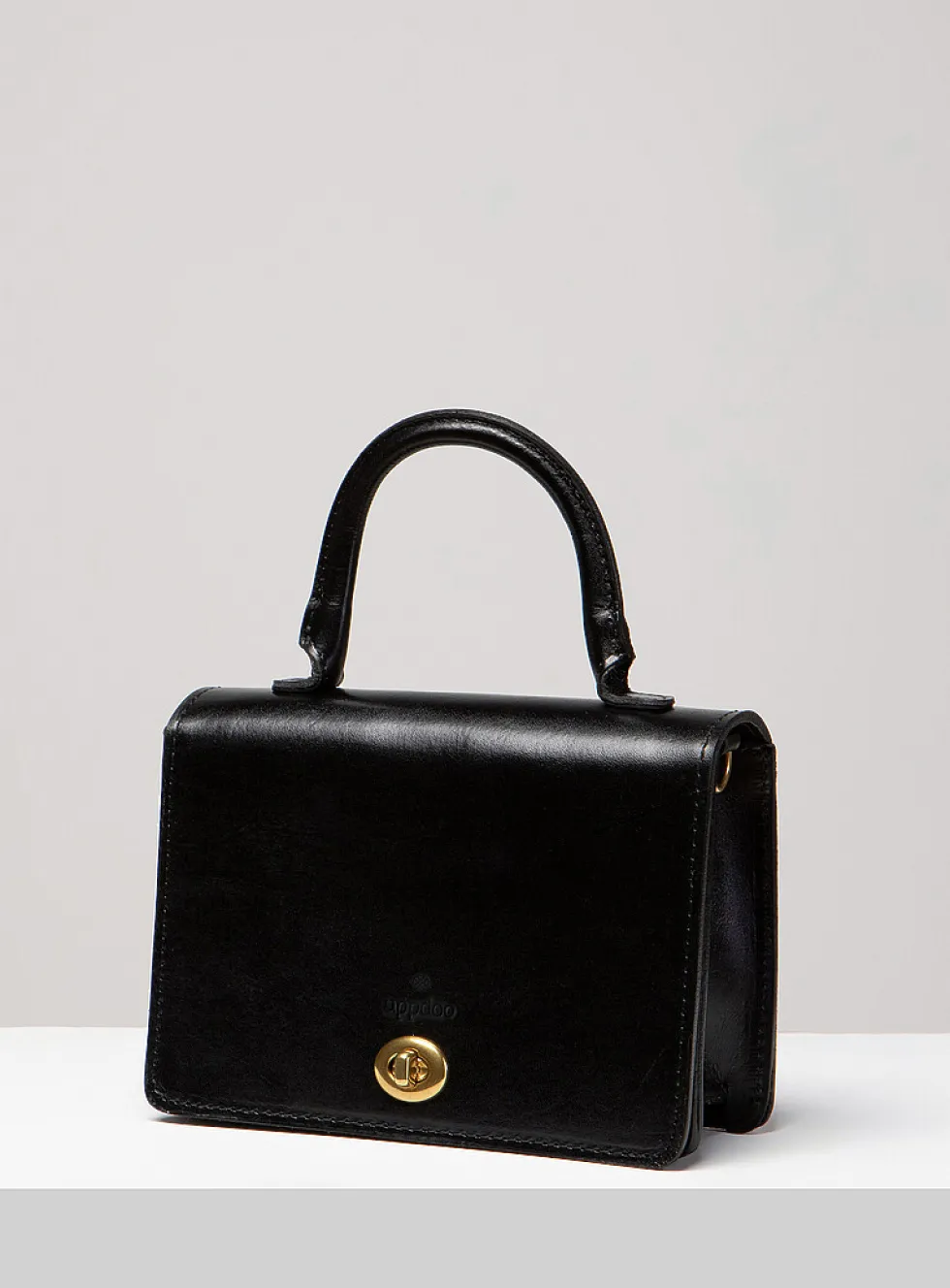 Minimalist Turn-loc closure handbag