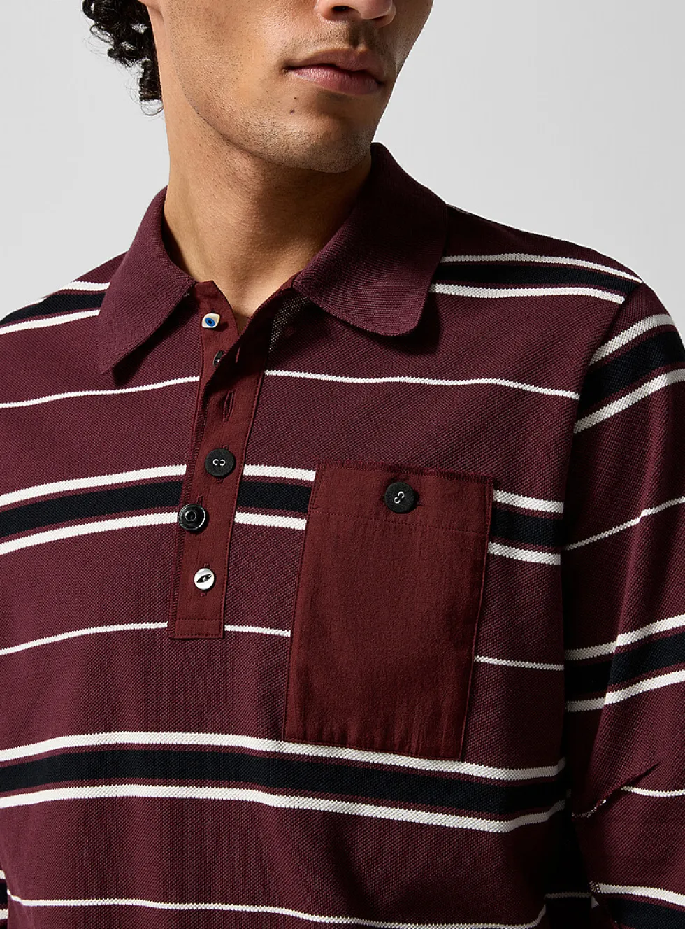 Mismatched-button rugby polo