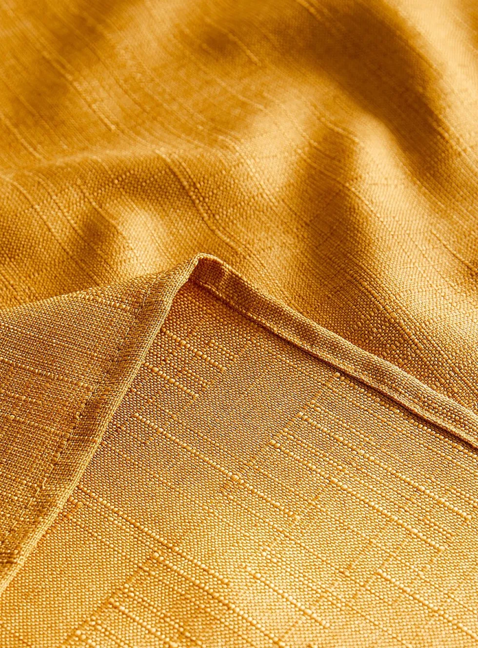 Mustard yellow textured tablecloth