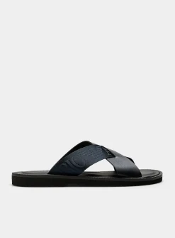 Navy blue leather crossed-strap sandals