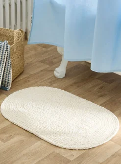 Oval reversible bath mat