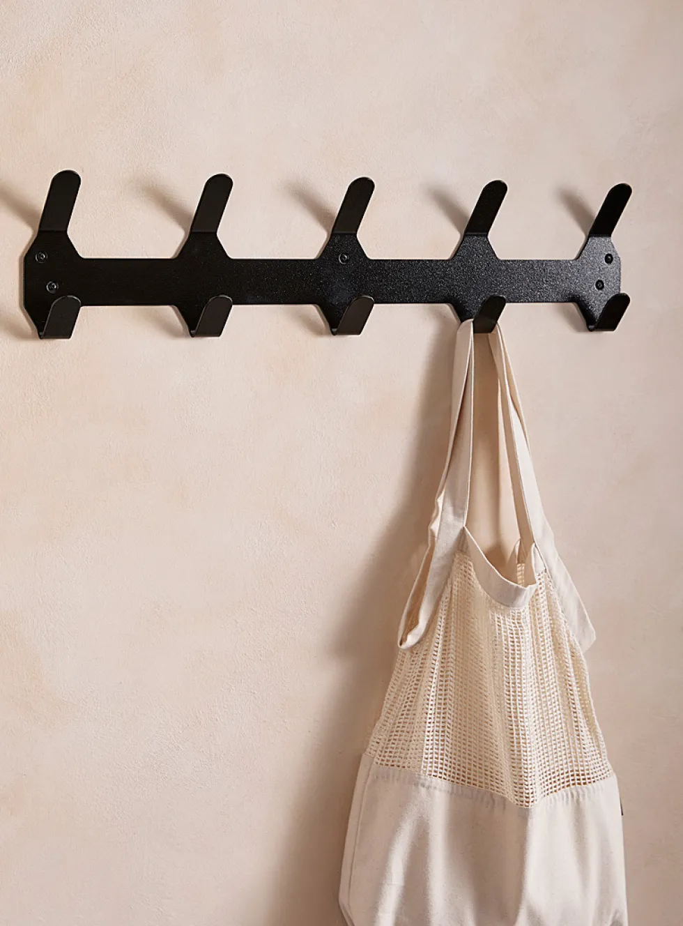 Painted aluminum monochromatic wall-mounted coat rack
