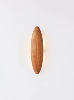 Permanence walnut wall sconce