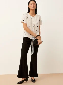 Polka-dotted short-sleeve crew-neck blouse