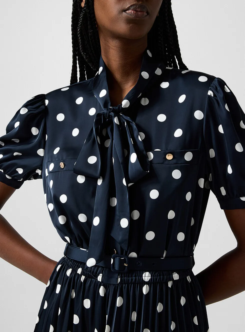 Polka-dotted tie-neck dress