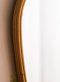 Rattan trim asymmetrical mirror