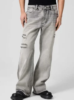 Raw edging mended flared-leg jean