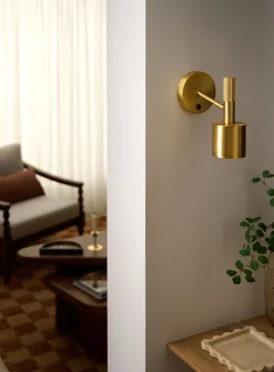 Rhoswen sleek brass finish wall sconce