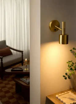 Rhoswen sleek brass finish wall sconce
