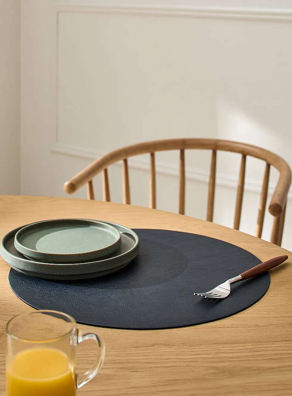 Round faux-leather placemat