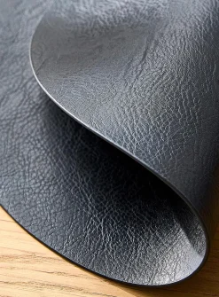 Round faux-leather placemat