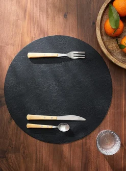 Round faux-leather placemat