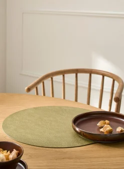 Round faux-leather placemat