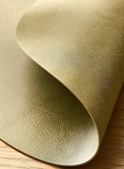 Round faux-leather placemat