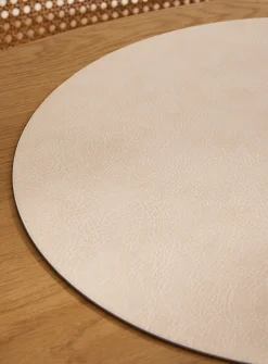 Round faux-leather placemat