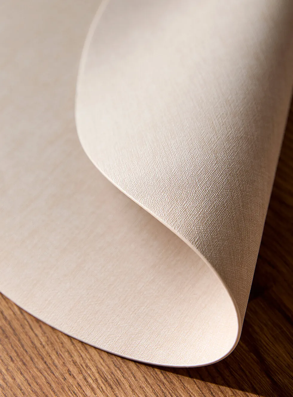 Round heathered faux-leather placemat