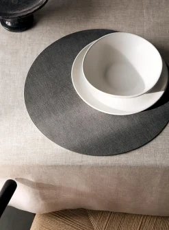 Round heathered faux-leather placemat