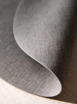Round heathered faux-leather placemat