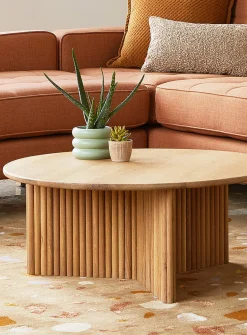 Round natural grooved coffee table