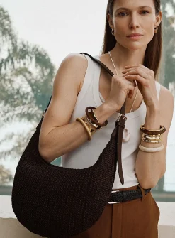 Rounded woven straw hobo bag