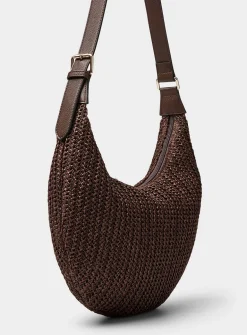 Rounded woven straw hobo bag