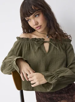 Ruffled off-the-shoulder blouse
