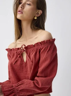 Ruffled off-the-shoulder blouse