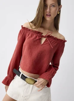 Ruffled off-the-shoulder blouse